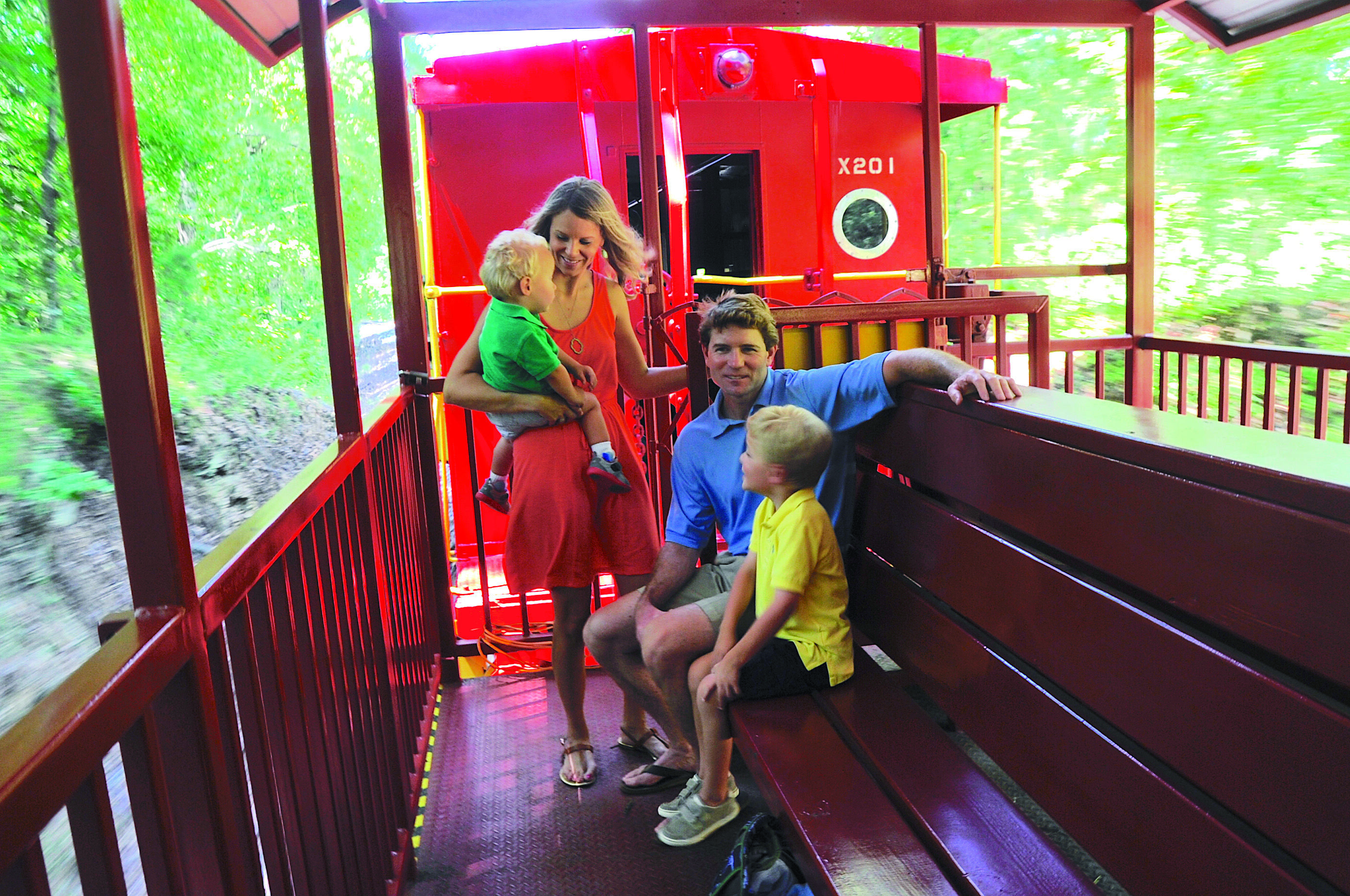 Family riding on a train at the Heart of Dixie Railroad Museum.