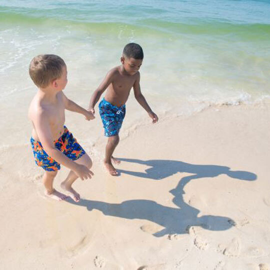 Children playing on beach in Gulf Shores, Alabama.